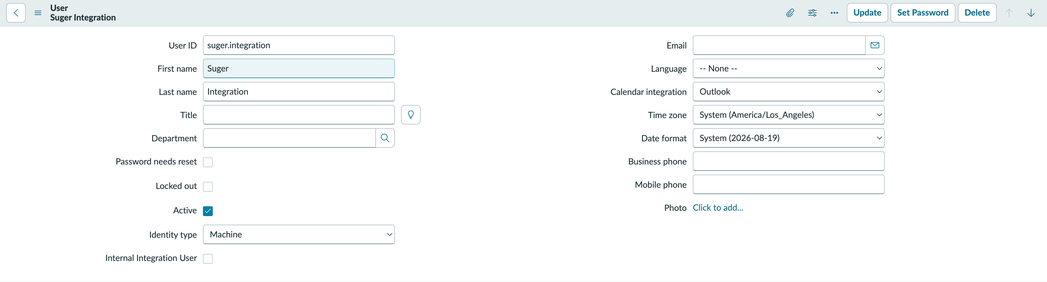 The saved integration user record with User ID suger.integration, Identity type set to Machine, Internal Integration User unchecked, and the empty Roles related list below